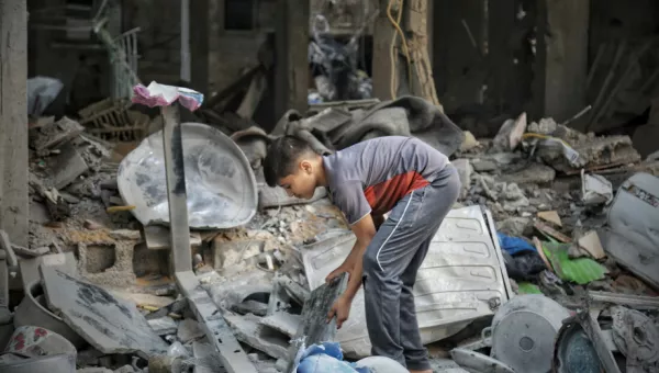 Child sorting through the rubble in Gaza. 