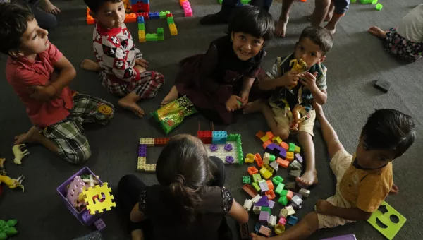 Children play with building blocks in a War Child child-friendly space in Iraq.