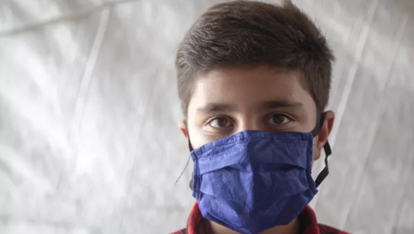 A boy wearing a mask during the pandemic.