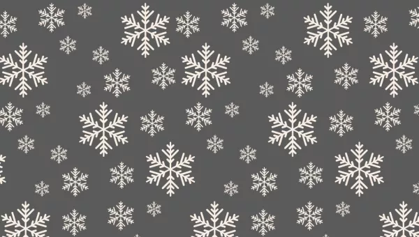 White snowflakes on a grey background. 