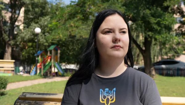 Ksenia sitting in a park