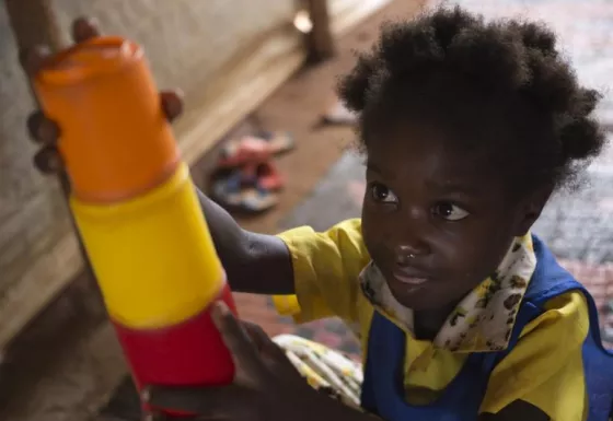 A young girl plays in one of War Child's child-friendly spaces, a place for her to forget the conflict and be a child again.